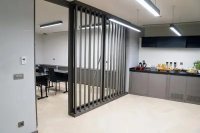 a kitchen and dining room with a table in the background at Galata's Hotel in Istanbul