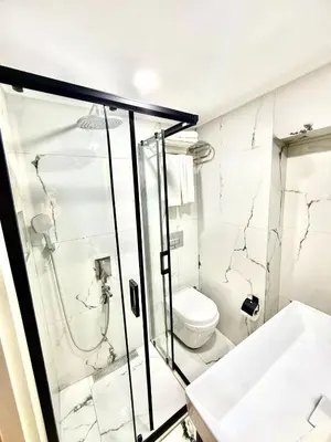 a bathroom with a shower and a toilet at New Florenta Hotel in Istanbul