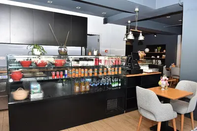 a restaurant with a bar with a table and chairs at Levent Lavandula Hotel in Istanbul