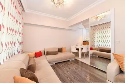 a living room with a couch and a table at İskete Suit in Istanbul