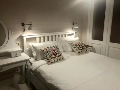 a bedroom with a white bed with two pillows on it at Mehmet Bey Suites in Istanbul