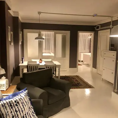 a living room with a couch and a table at Mehmet Bey Suites in Istanbul