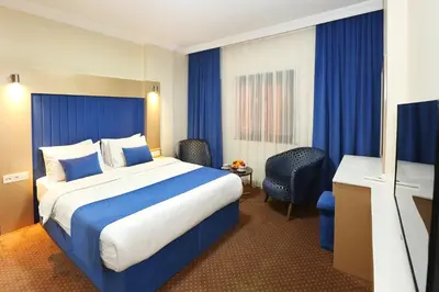 a hotel room with a bed and a television at Taksim ABC Hotel in Istanbul