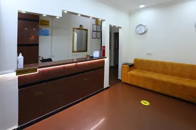 a waiting room with a couch and a mirror at Taksim ABC Hotel in Istanbul