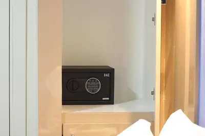 a microwave sitting on a shelf in a closet at Taksim ABC Hotel in Istanbul