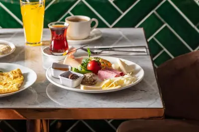 a plate of food on a table with a plate of food at Danis Hotel & Spa Istanbul - Old City in Istanbul