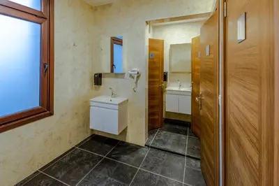 a bathroom with a toilet and a sink and a mirror at Sanat Hostel Taksim in Istanbul