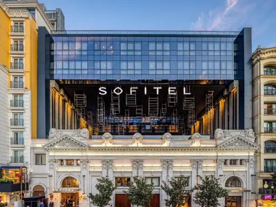 a building with a sign on top of it at Sofitel Istanbul Taksim in Istanbul