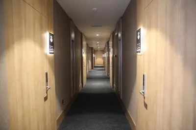 a long hallway with wooden walls and a long aisle at RADAR HOTEL in Istanbul