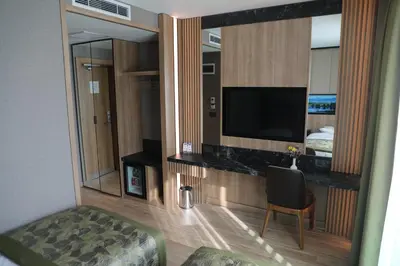a hotel room with a television and a bed at RADAR HOTEL in Istanbul
