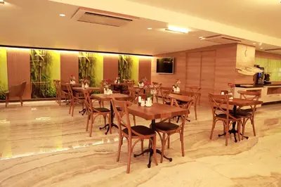 a dining room with wooden tables and chairs at RADAR HOTEL in Istanbul