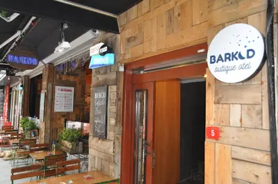 a restaurant with a sign on the side of a building at Barkod Otel in Istanbul