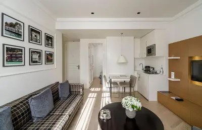 a living room with a couch and a table at Stay Lab Taksim 15 Suites in Istanbul
