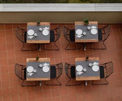 a group of tables and chairs on a patio at Stay Lab Taksim 15 Suites in Istanbul