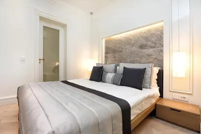 a bedroom with a large bed with two pillows at Stay Lab Taksim 15 Suites in Istanbul