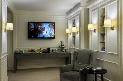 a room with a desk and a chair and a television at Stay Lab Taksim 15 Suites in Istanbul