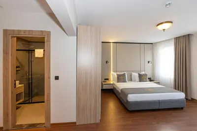 a hotel room with a bed and a bathroom at Yez Boutique Hotel in Istanbul
