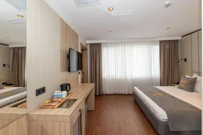 a hotel room with a bed and a desk at Yez Boutique Hotel in Istanbul