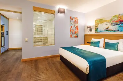 a bedroom with a large bed and a window at Urban Hotel Bomonti in Istanbul