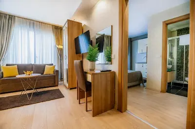 a living room with a couch and a table at Kavalalı Suites in Istanbul