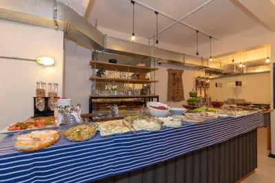 a buffet line with many different types of food on it at Rumours Inn in Istanbul
