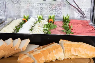 a tray of food with cheese and bread at Mytra Hotel in Istanbul
