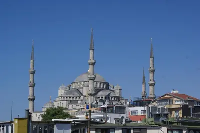 a mosque with two minarets in a city at Mytra Hotel in Istanbul