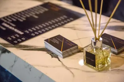 a table with a keyboard and a vase with flowers in it at Mugwort Hotel & Spa in Istanbul