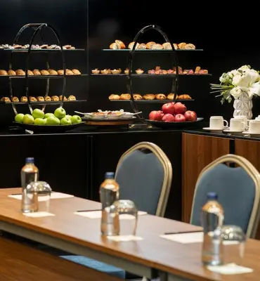 a table with chairs and plates of food on display at Radisson Blu Hotel, Sakarya in Sakarya