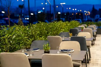 a row of tables and chairs at a restaurant at Radisson Blu Hotel, Sakarya in Sakarya