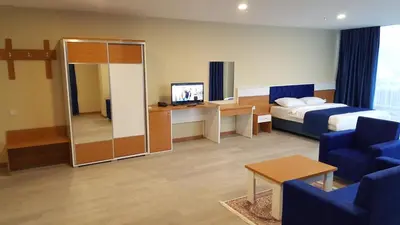 a hotel room with a bed and a tv at SKYBLUE İSTANBUL HOTEL in Istanbul