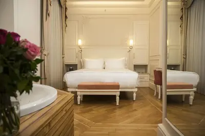 a bedroom with a bed and a bath tub and a bath tub at Corinne Art & Boutique Hotel in Istanbul