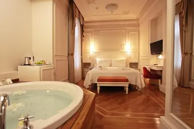 a bathroom with a bed and a bath tub at Corinne Art & Boutique Hotel in Istanbul