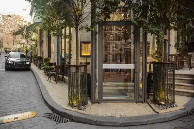 a building with a revolving door on a city street at Corinne Art & Boutique Hotel in Istanbul