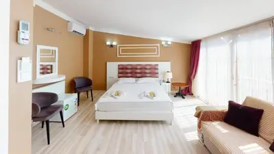 a hotel room with a bed and a couch at The Wolf Hotel in Istanbul