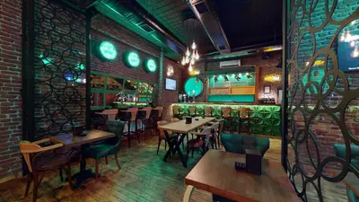 a restaurant with tables and chairs and a bar at The Wolf Hotel in Istanbul