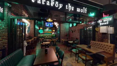 a restaurant with tables and chairs and a bar at The Wolf Hotel in Istanbul