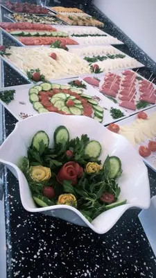 a row of plates of food on a table at Grand Rimedya Hotel Bursa in Panayır