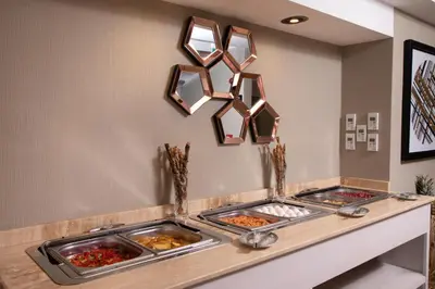 a buffet with two trays of food on a counter at Catch Sultanahmet-Special Class in Istanbul