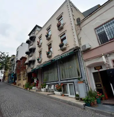 a street with a building with plants on it at Lika Hotel in Istanbul