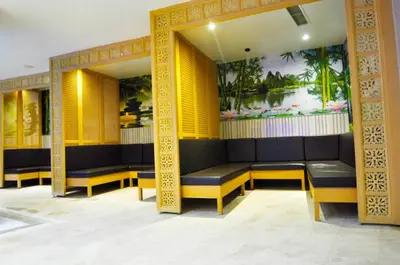 a waiting room with yellow and black benches at Black Bird Thermal Hotel & SPA in Gokcedere