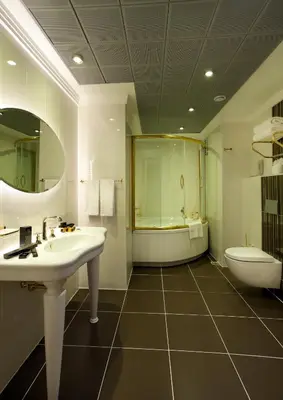 a bathroom with a sink and a tub and a toilet at Black Bird Thermal Hotel & SPA in Gokcedere