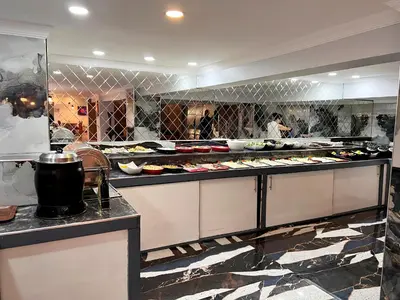 a kitchen with a bunch of food on display at Comfort Downtown Istanbul Hotel in Istanbul