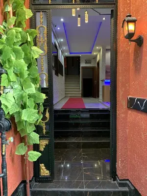 a hallway with a mirror and stairs in a building at Taxim Hotel Marin in Istanbul