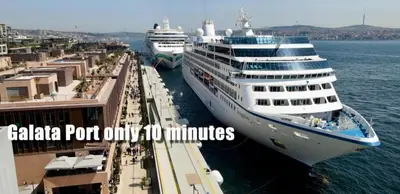 two cruise ships are docked in a harbor at Hotel Gritti Pera & Spa in Istanbul