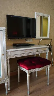 a desk with a television on top of it at Hotel Gritti Pera & Spa in Istanbul