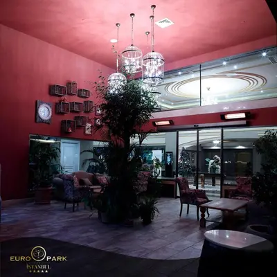 a lobby of a restaurant with tables and chairs at Euro Park Otel in Istanbul