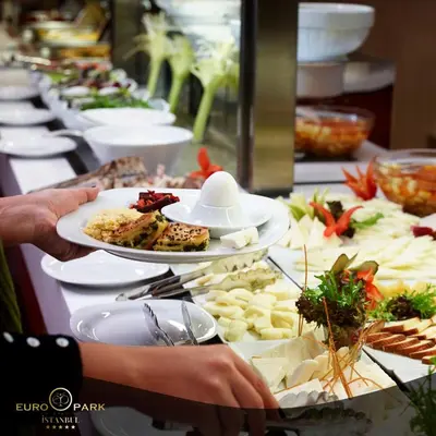 a buffet with plates of food on a table at Euro Park Otel in Istanbul