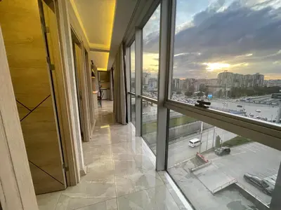 a room with a large window and a view of a city at Le Luxe Suites Hotel in Bursa
