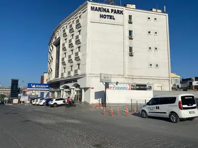 a large building with cars parked in front of it at Marina Park Hotel in Istanbul